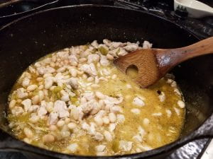 white pheasant chili cooking in cast iron pot