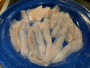 raw perch strips on plate