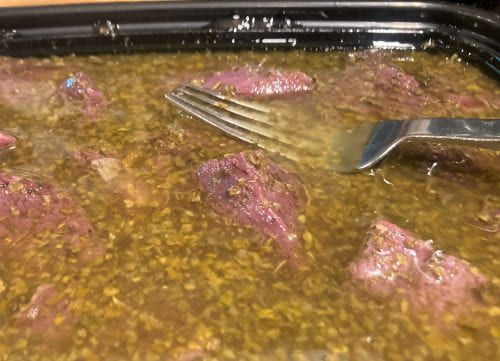 cubed goose meat in marinade